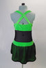 Black mesh and green velvet sparkle velvet costume has a black large meshed skirt and wide crossed back straps. Has crystal details at bust and waist. Comes with long mesh gauntlets and crystal hair barrette. Back