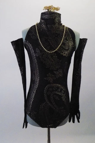 Black leotard has a high necked halter collar and an open back. The textured gold pattern is an intricate design of paisley reminiscent of the 1930s and is accented by an attached strand of gold pearls Comes matching Long gloves and a gold and crystal hair barrette. Front