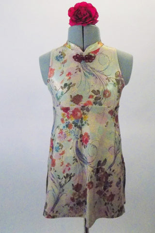 Nude based oriental inspired A-line lyrical dress has cascading rose and floral print in earth-tones. The mandarin collar is accented with a braided frog clip closure. Comes with nude briefs and hair flower. Front