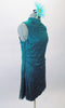 Lovely teal chiffon tunic dress has a delicate floral pattern with sequined accents. The open keyhole back gives it a revealing flare. Comes with a floral hair accessory. Side