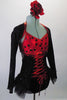 Gorgeous leotard with corset lace up front and open back had red and black polka dot bust and black sequined bottom with layered bustle skirt. The black sequined mini shrug with matching red piping sits on shoulders just above the bra leaving the lower back exposed. Right side