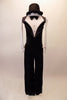 Black and white, halter unitard has tuxedo style front bodice with crystalled faux lapels, button accents and bow tie. The faux cummerbund at the waist separates the torso from the velvet pants. Comes with long white gloves and matching top hat. Front
