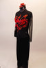 Long sleeved black mesh unitard has red flame accents on the bust, back and sleeves. The pant portion is a straight cut black velvet and the unitard zips at the back. Comes with red mini hat accessory. Left side