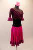 Pink and black, off the shoulder, knee-length dress has an alternate colour block of hot pink and black polka dots and stripes with black velvet crystal scattered midriff. The nude straps hold the dress in place. Comes with a hair accessory. Side