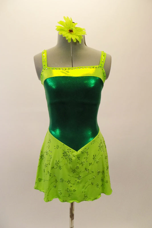 Emerald green leotard tank dress has apple green accent at bust and a chiffon floral apple green short skirt. Shows beautifully on stage. Comes with a floral hair accessory. Front