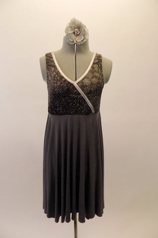 Steel grey chiffon dress has faux wrap bodice with sparkled marble print and silver piping.  Comes with a floral hair accessory. Front