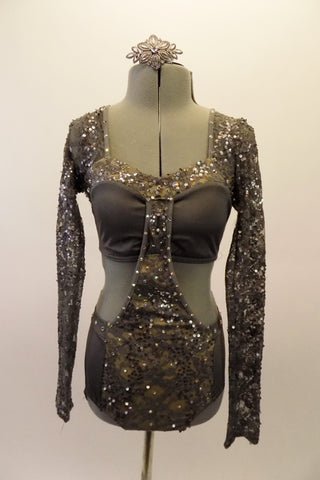 Steel grey leotard is actually a 2-piece joined at the front torso by an extension of the front lace panel of the brief. The sleeves, shoulders and front of the brief is a beautiful sequined lace while the bandeau bust and back/sides of the brief are a steel grey stretch. The costume is accented throughout with crystals. Comes with matching hair barrette. Front