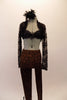 Brown and black crackle patterned leggings are accompanied by a black satin bra (32A), a long-sleeved black lace shrug. Comes with black feather hair accessory. Front