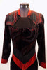 Long sleeved unitard is a black velvet base and zip back. The top portion has glitter swirls and red mandarin collar and cuffs. The waist is a sheer black mesh with shiny red band that comes to a point. Comes with a hair accessory. Front zoomed