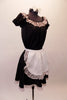 Three-piece maid or waitress costume had black pouffe sleeved blouse with lace trim. The matching black pull-on skirt has lace trim and an attached large white lace edged apron. Comes with separate black bottom and bow hair accessory. Side