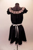 Three-piece maid or waitress costume had black pouffe sleeved blouse with lace trim. The matching black pull-on skirt has lace trim and an attached large white lace edged apron. Comes with separate black bottom and bow hair accessory. Back