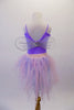 Pale lavender leotard has pinched front and comes with a pale pink pull-on chiffon fringe ballet skirt. Sheer white and silver fairy wings pin to the back. Comes with a lavender floral hair accessory. Back
