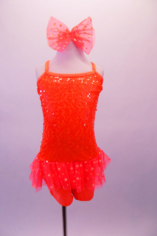 Cheery bright orange sequined short unitard shows well on stage. It has sheer polka dot ruffle skirt and cross back straps. Comes with matching bow hair accessory. Front