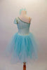 Delicate pale aqua romantic tutu dress has a single shoulder sparkle bodice with sequined trim and butterfly sleeves. Multiple layers of soft aqua tulle comprise the skirt. Comes with a floral hair accessory. Back
