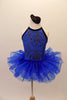 Stunning royal blue leotard dress has a fluffy layered pull-on skirt. The halter bodice has a black and silver velvet paisley motif and black edging. The open back has delicate vertical straps extending from the collar. Comes with a paisley hair accessory. Front
