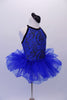 Stunning royal blue leotard dress has a fluffy layered pull-on skirt. The halter bodice has a black and silver velvet paisley motif and black edging. The open back has delicate vertical straps extending from the collar. Comes with a paisley hair accessory. Side