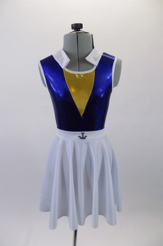 Naval themed two-piece costume has a royal blue metallic effect leotard with triangular gold inlay at bust. The white naval collar compliments the accompanying knee length skirt with crystal anchor detail. Comes with matching captain’s hat. Front