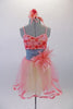 Pretty coral dance dress has coral and yellow mesh skirt with wide ribbon edging. The bodice has 3D applique flowers in shades of coral and a large coral flower accents the left side if the wide grey waistband. Comes with matching floral hair accessory. Front