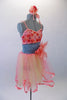Pretty coral dance dress has coral and yellow mesh skirt with wide ribbon edging. The bodice has 3D applique flowers in shades of coral and a large coral flower accents the left side if the wide grey waistband. Comes with matching floral hair accessory. Right side