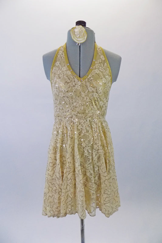 Cream lace with golden sequins sits over top of an antique gold base halter style dress. The open back gives the dress a soft feel. Comes with cream and gold floral hair accessory. Front