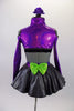 three-piece costume has a black lace bra base (30A) with purple sparkle, long sleeved, cold shoulder shrug with neon green button accent. The accompanying skirt is a concrete grey overlay on top of purple & green tulle & matching waistband with large green bow at the back. Comes with floral hair accessory. Back