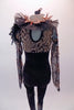 Full black unitard had a brown animal print bust area and long black lace sleeves with twine accents. Brown and black feathers accent the shoulders along with black organza ruffle collar.  Comes with feather hair accessory. Back