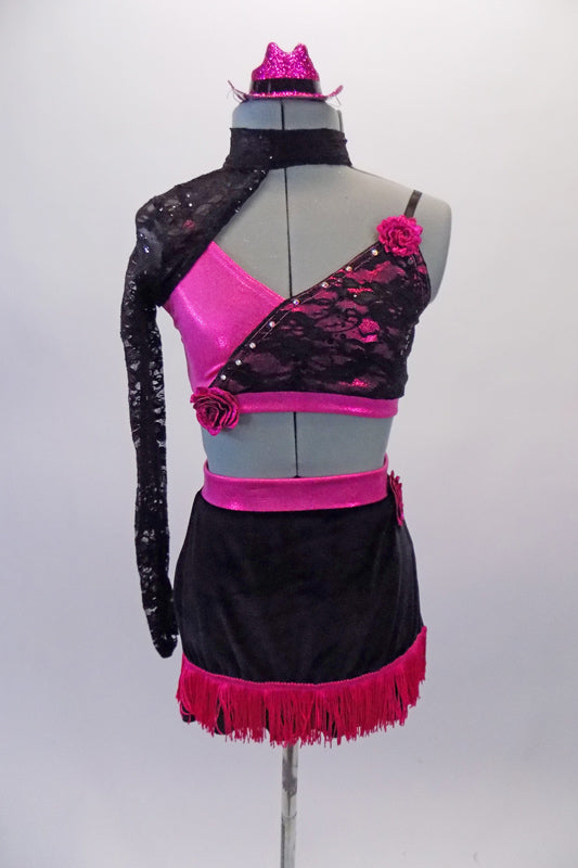 Hot pink & black costume has a pink cross over bra with black lace on left bust. The bra is accented with crystals & satin rose embellishments. The choker collar single sleeved lace shrug adds some pizazz. The bottom is a black velvet skirt with hot pink fringe and side slit accented with a large rose on the left hip. Front