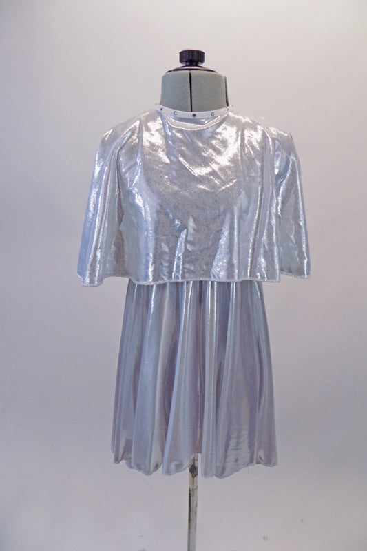 Soft and light silver flowing dress is simple with round neckline and empire waist. It comes with a crystalled silver removable poncho.  Front