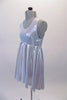 Soft and light silver flowing dress is simple with round neckline and empire waist. It comes with a crystalled silver removable poncho.  Left side. no poncho