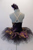 Peacock themed ballet tutu has a black base with beautiful gold & purple embroidered lace designs on the bodice & sheer overlay. The nude straps cross over at the back for good support. The accompanying black pull-on tutu & black briefs create the stunning base. Comes with a large matching hair accessory. Back