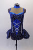 Sparkling costume is a navy blue stretch velvet base with swirls of glittery silver and royal blue. The center of the torso has faux silver boning and corset lace design on royal blue center. The upper bust area is a nude mesh with crystal accented royal blue collar and banding. The peplum skirt gives the costume a cute flirty look. Comes with crystal hair barrette. Front