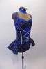 Sparkling costume is a navy blue stretch velvet base with swirls of glittery silver and royal blue. The center of the torso has faux silver boning and corset lace design on royal blue center. The upper bust area is a nude mesh with crystal accented royal blue collar and banding. The peplum skirt gives the costume a cute flirty look. Comes with crystal hair barrette. Right side