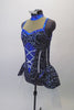 Sparkling costume is a navy blue stretch velvet base with swirls of glittery silver and royal blue. The center of the torso has faux silver boning and corset lace design on royal blue center. The upper bust area is a nude mesh with crystal accented royal blue collar and banding. The peplum skirt gives the costume a cute flirty look. Comes with crystal hair barrette. Left side