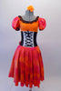 The layers of petticoat and orange bustle with bow, create loads of volume beneath a colourful skirt in shades of red pink & orange. The skirt portion of the dress compliments the orange bodice, ruffled neckline, pouffe sleeves and faux corset laced waistband. Front