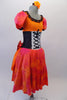 The layers of petticoat and orange bustle with bow, create loads of volume beneath a colourful skirt in shades of red pink & orange. The skirt portion of the dress compliments the orange bodice, ruffled neckline, pouffe sleeves and faux corset laced waistband. Right side