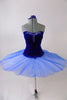 Royal blue ballet bodice is princess cut with low back & clear cross-back straps. Front bust area & upper back have beautiful blue beaded appliques. The matching blue sheer overlay has a velvet bask to compliment the bodice & tiny loopholes to attach to a tutu below. Comes with arm pouffes & appliqued hair accessory. Front