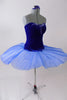 Royal blue ballet bodice is princess cut with low back & clear cross-back straps. Front bust area & upper back have beautiful blue beaded appliques. The matching blue sheer overlay has a velvet bask to compliment the bodice & tiny loopholes to attach to a tutu below. Comes with arm pouffes & appliqued hair accessory. Side