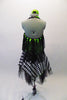 Black & white checkered harlequin themed dress has a lime green cross-over, halter bodice with attached black mesh kerchief accents cascading throughout. Swarovski crystals are scattered within the checkered pattern of the fabric that sits over layers of black tulle. Comes with a green floral hair accessory. Back