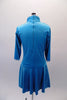 Futuristic dress with mandarin collar, side button, blazer styling has silver piping and buttons on shimmery turquoise velvet. The back has a full zipper closure. Back