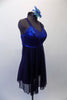 Navy blue Empire-waist dress has a shimmery blue bust area with crystal accents. The attached sheer mesh skirt cascaded in layers to create a soft flow. Comes with a floral hair accessory. Side