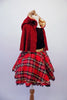 Black velvet leotard has a red glittery tartan pattern in the fabric. The accompanying red tartan skirt has gold waistband and sequin accent with black lace trim and tricot black petticoat. The finishing piece is a removable, gold lined, sparkly red hooded cape. Right side with hood.