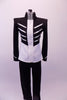 Military style Michael Jackson inspired costume is a black and white front-zip jacket with heavy shaped shoulder cups decorated with silver braiding and ball buttons. The jacket is complemented by black skinny pants. Front
