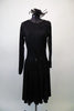Simply elegant black long-sleeved dress has sheer floral lace left sleeve, shoulder and waistband with a lace cascade from right hip. Comes with flack rose fascinator hair accessory. Front