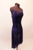 Beautiful navy sequined leotard dress has intricately crossed back straps lined with crystal accents. The attached chiffon high-low skirt softens the look. Comes with crystal hair barrette. Side