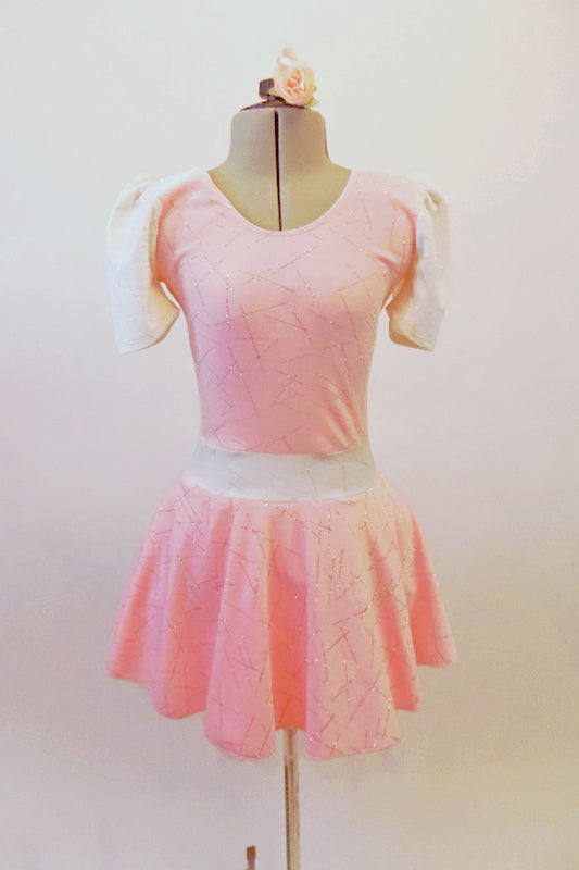 Pale pink velvet dress has a silver scratch pattern. The white velvet cap sleeves and waistband with large back bow. Comes with a pink floral hair accessory. Front