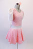Pale pink velvet dress has a silver scratch pattern. The white velvet cap sleeves and waistband with large back bow. Comes with a pink floral hair accessory. Side
