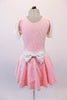 Pale pink velvet dress has a silver scratch pattern. The white velvet cap sleeves and waistband with large back bow. Comes with a pink floral hair accessory. Back