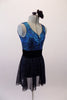 Blue-green scale pattered leotard has low scoop back and gathered bust. The accompanying pull-on skirt is a sheer black with shimmery sparkle. Comes with a hair accessory. Side