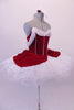 Gorgeous red velvet tutu has a red leotard base with white boning & princess cut. The neckline is draped with white chiffon that joins at the center of the back.  The skirt is comprised of a white tulle pull-on tutu with chiffon & red velvet overlay. Comes with white floral hair accessory & clear straps. Right side