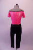 Fully sequined bright pink and black capri-length unitard is an off-shoulder top with black piping, cap sleeves, nude shoulder straps and black button accents. The attached black capri pat is a straight leg with gathered waistband and crystal ring buckle accent. Comes with a hair accessory. Back
